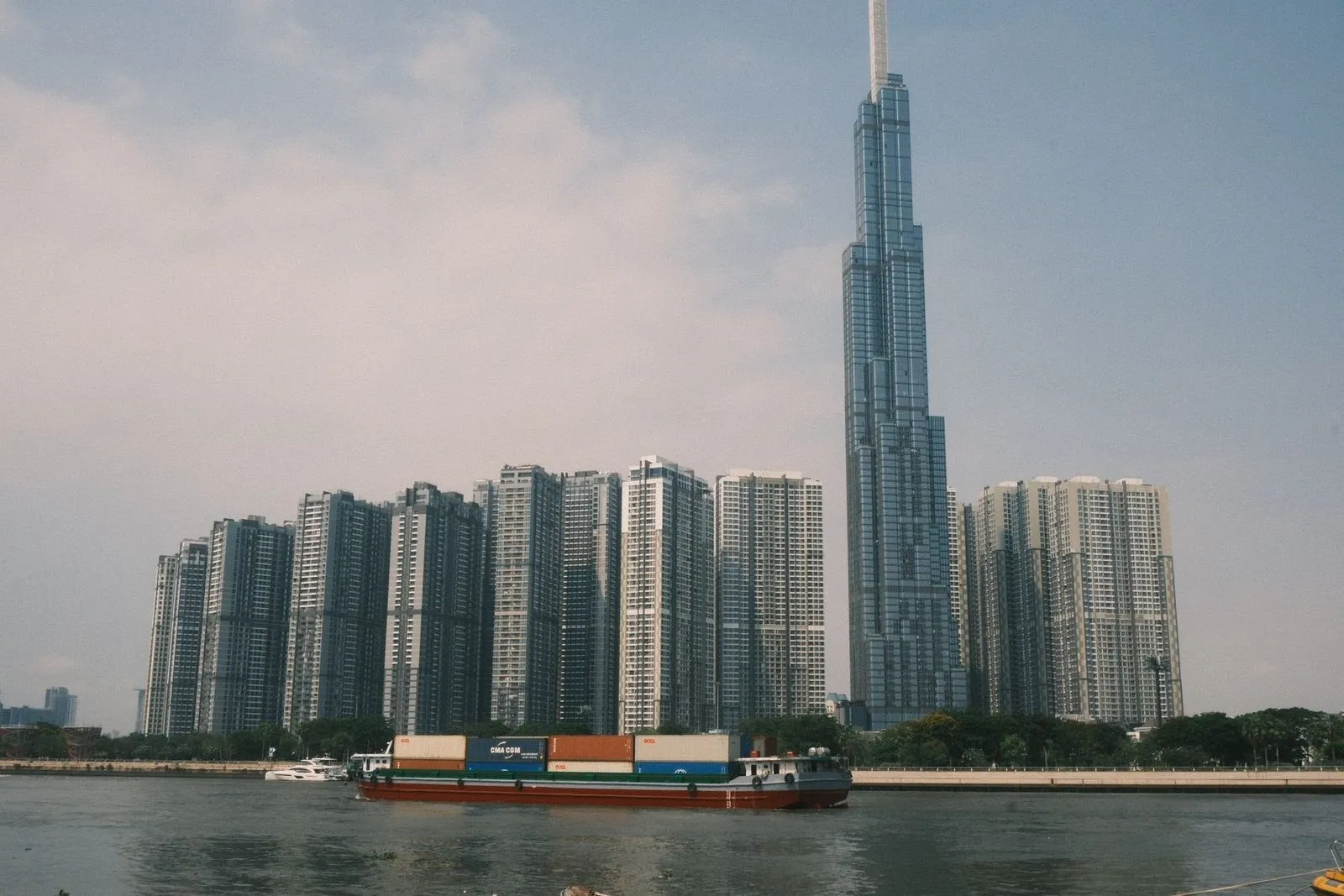Landmark 81 tower beside Vinhomes Central Park apartment towers on the Saigon River