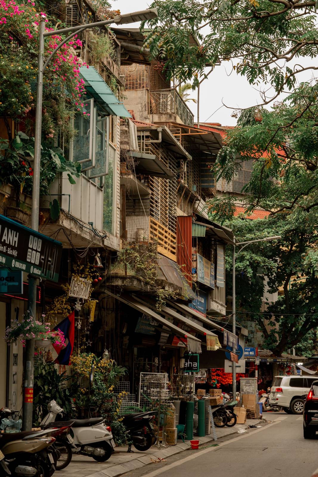 City street lined with tall buildings in central Vietnam