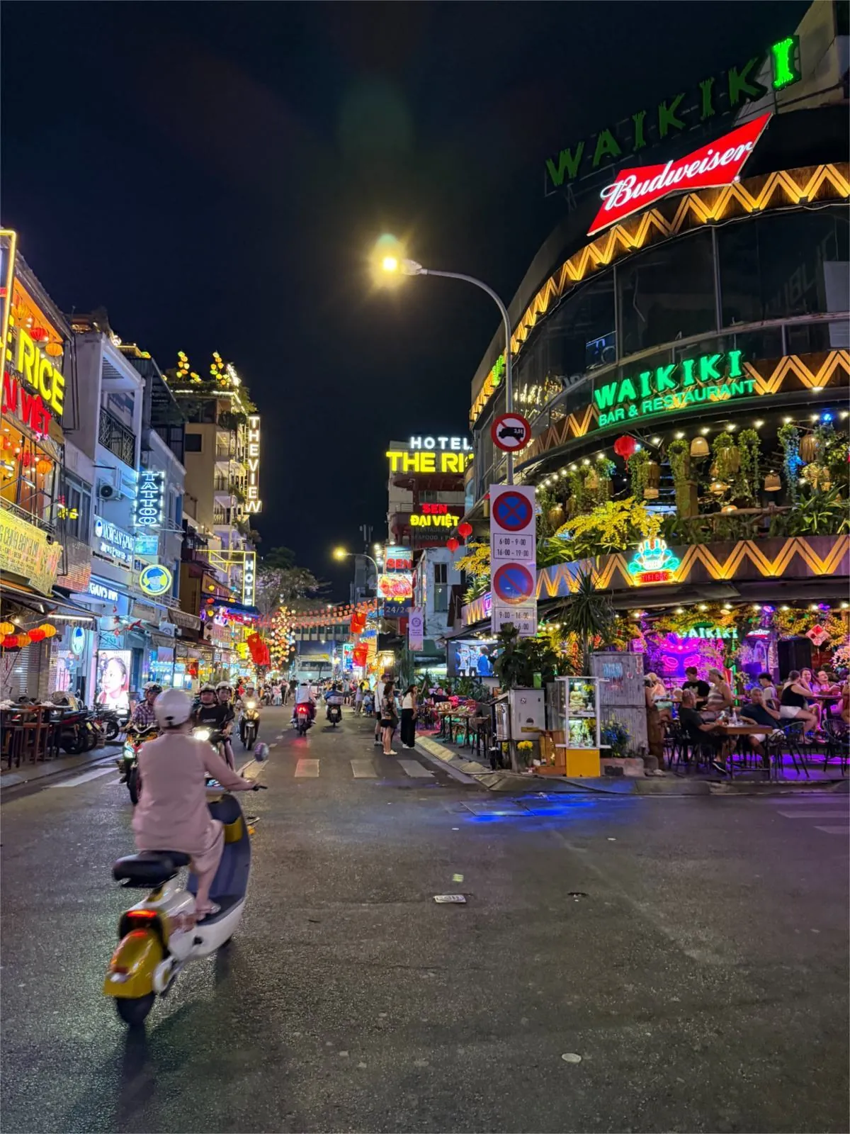 person on scooter in busy Ho Chi Minh City street