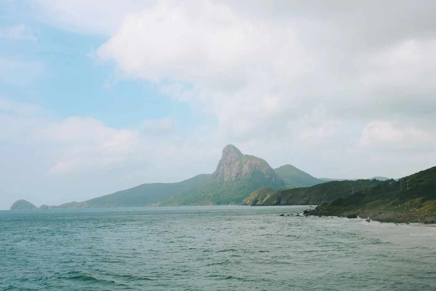 Mountain on Con Son island seen from the water on a hazy day