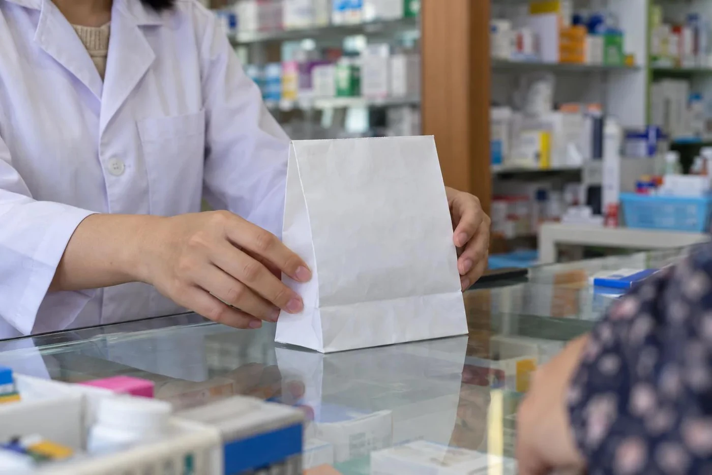 Pharmacy counter with boxes of medicine and vials