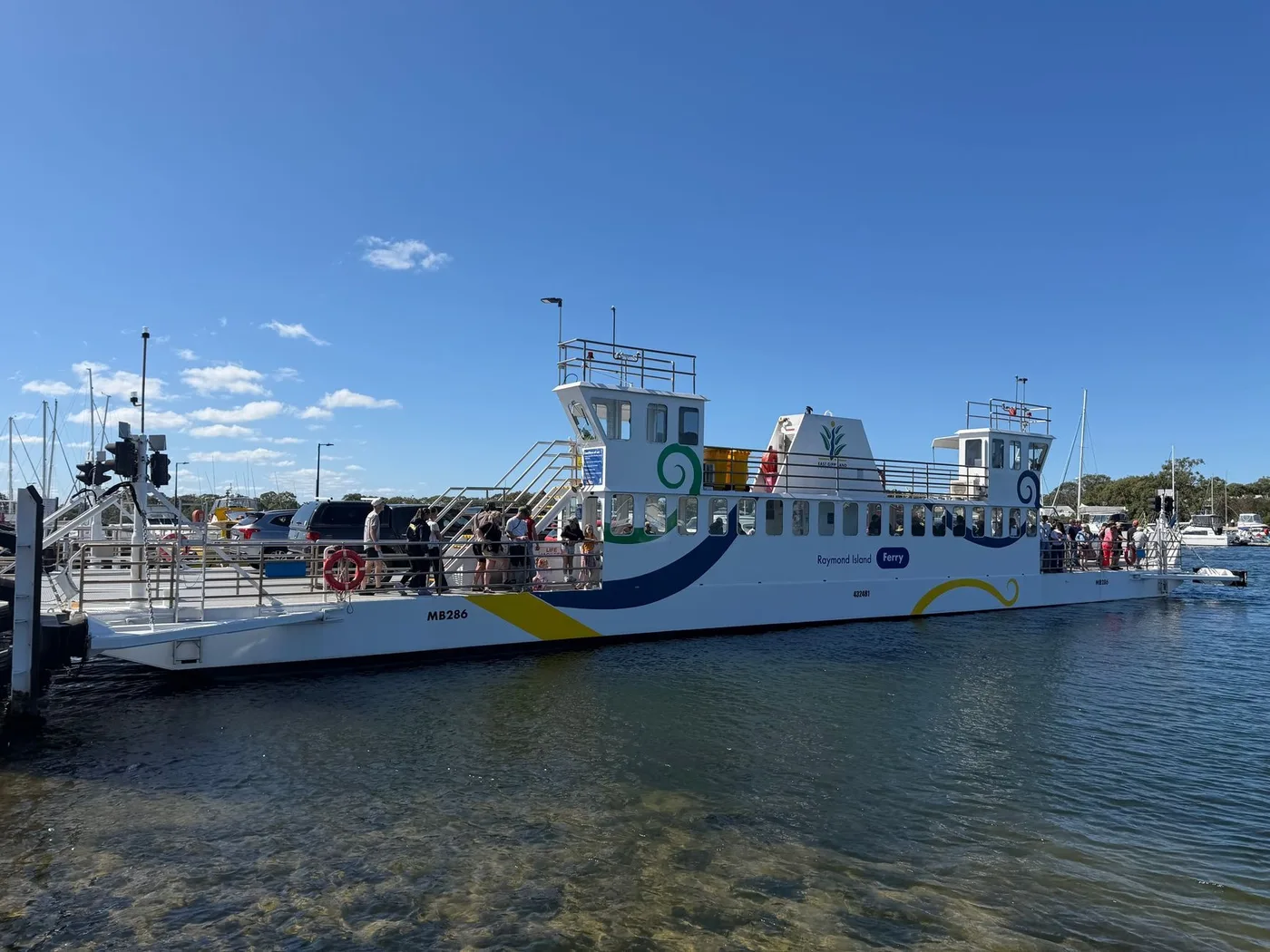 A passenger ferry docked at a terminal pier