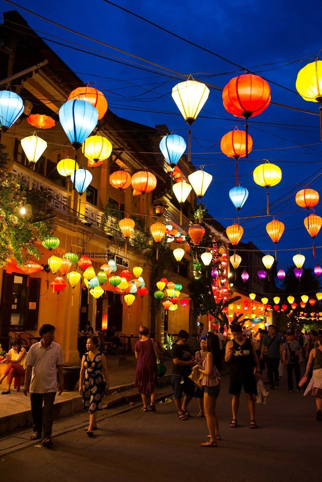 Colorful lanterns lit up over a night street in Hoi An, Vietnam