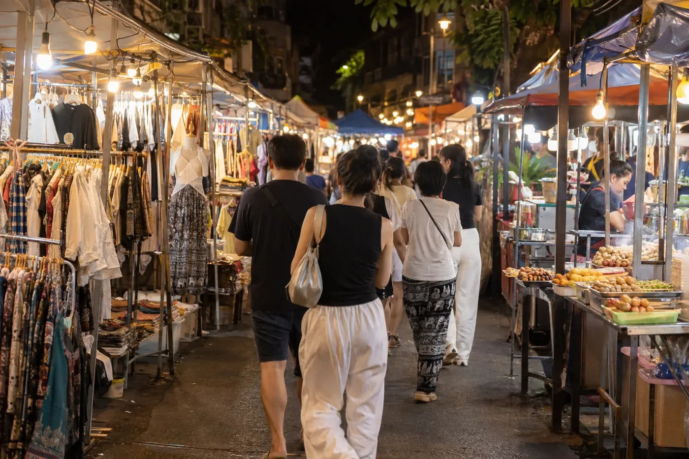 Lit stalls of a night market after dark