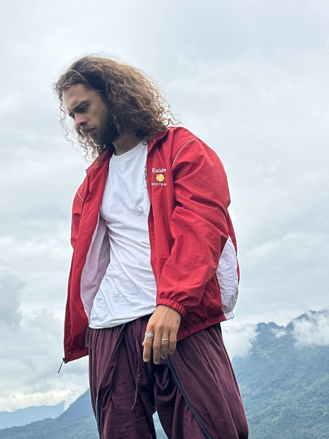 traveler looking down over misty mountain clouds near Sapa