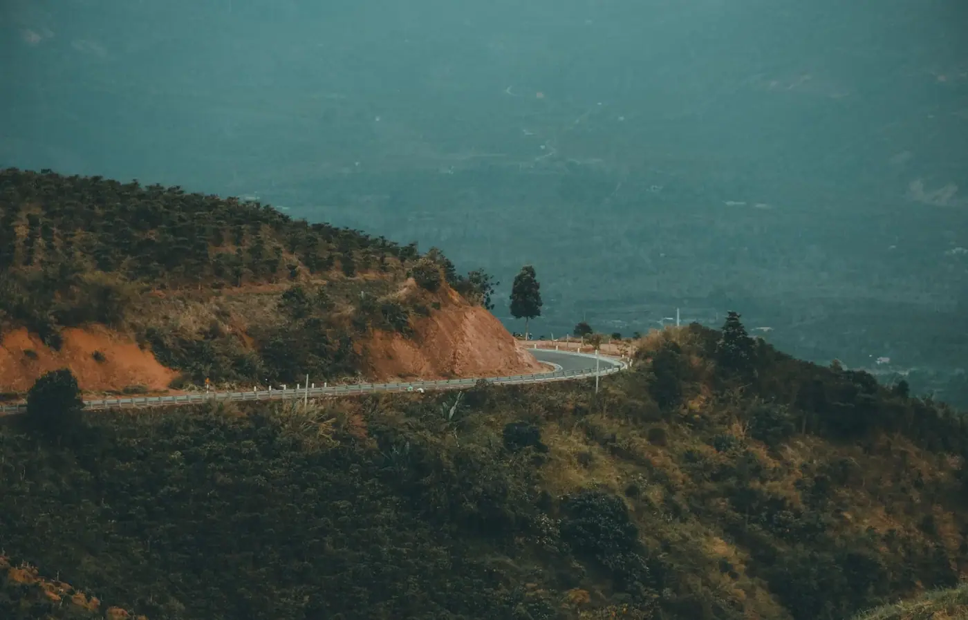 Vietnam highway winding through green mountains north of Hue