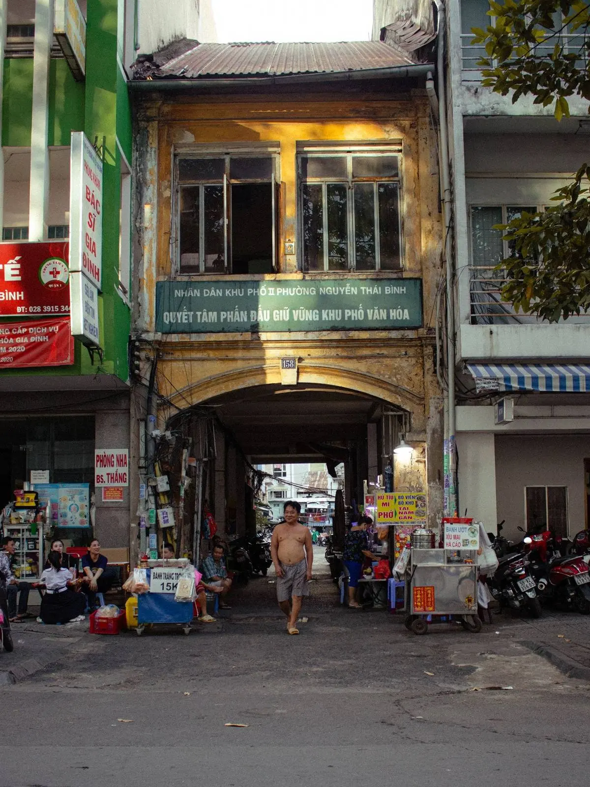 Nha Trang street with shops and arched doorway, expat district