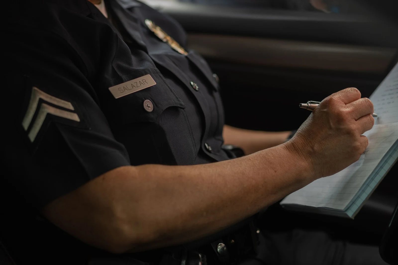 Police officer writing an incident report