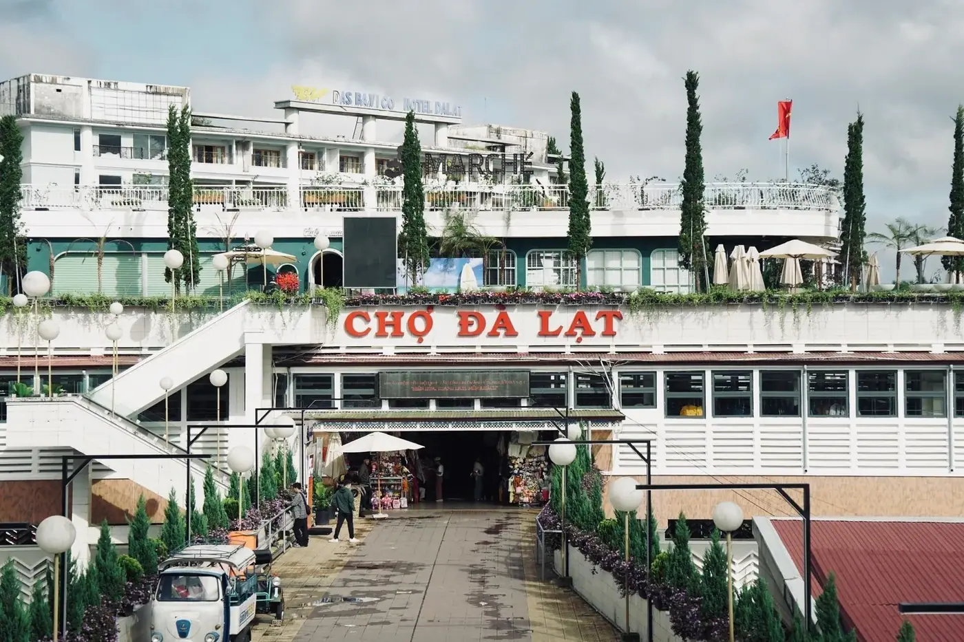 The entrance to Da Lat Market with its red rooftop sign in Vietnam’s Central Highlands