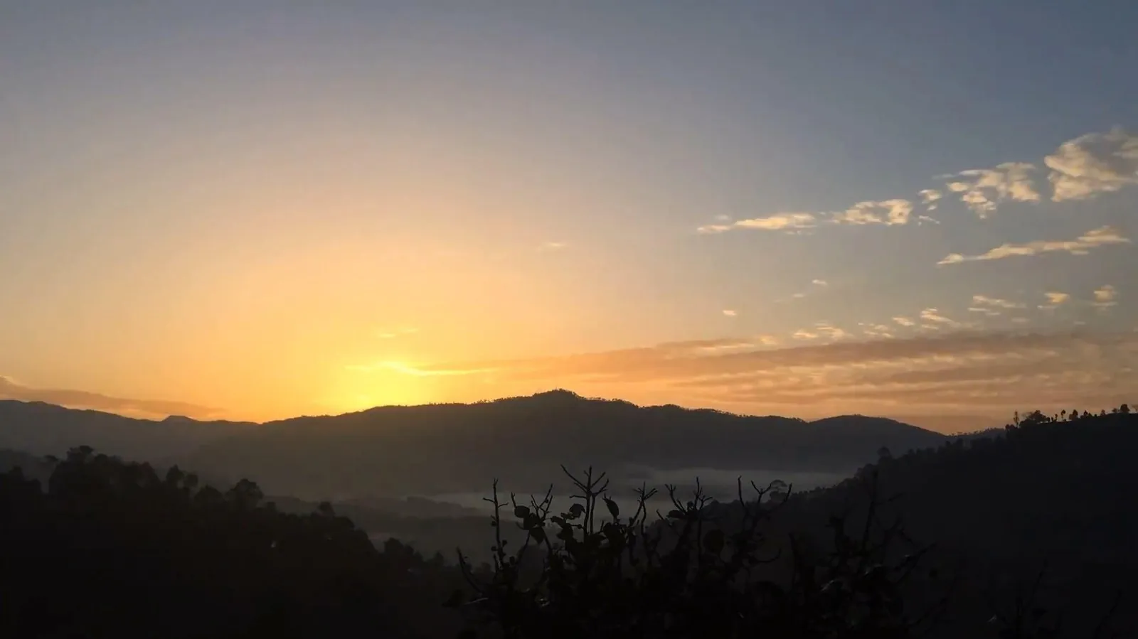 sunrise over misty mountains in Vietnam