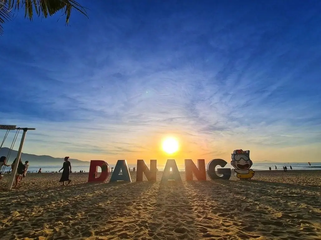 Da Nang beach sign on the sand at sunset