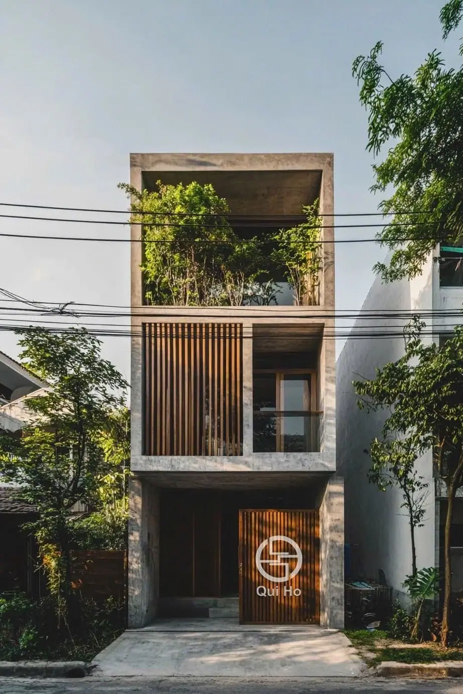 narrow three-story house with wooden slat facade, Da Nang