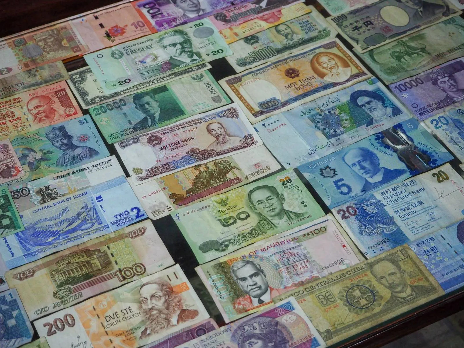 Pile of world banknotes including Vietnamese dong and Russian ruble bills