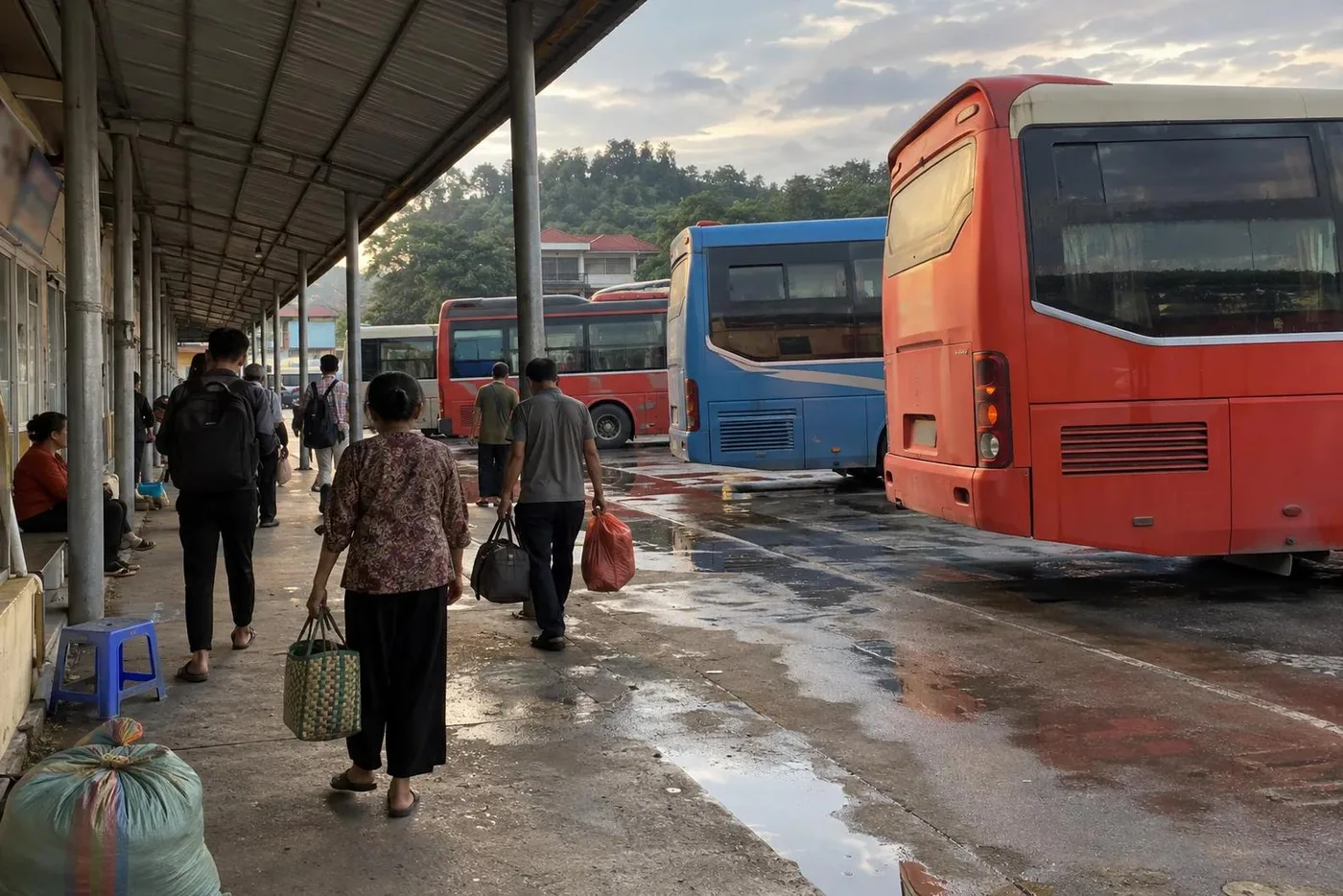 Coaches lined up at a Vietnamese bus station platform
