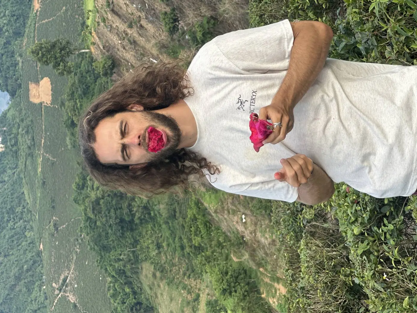 Traveler eating dragonfruit at Moc Chau tea plantations