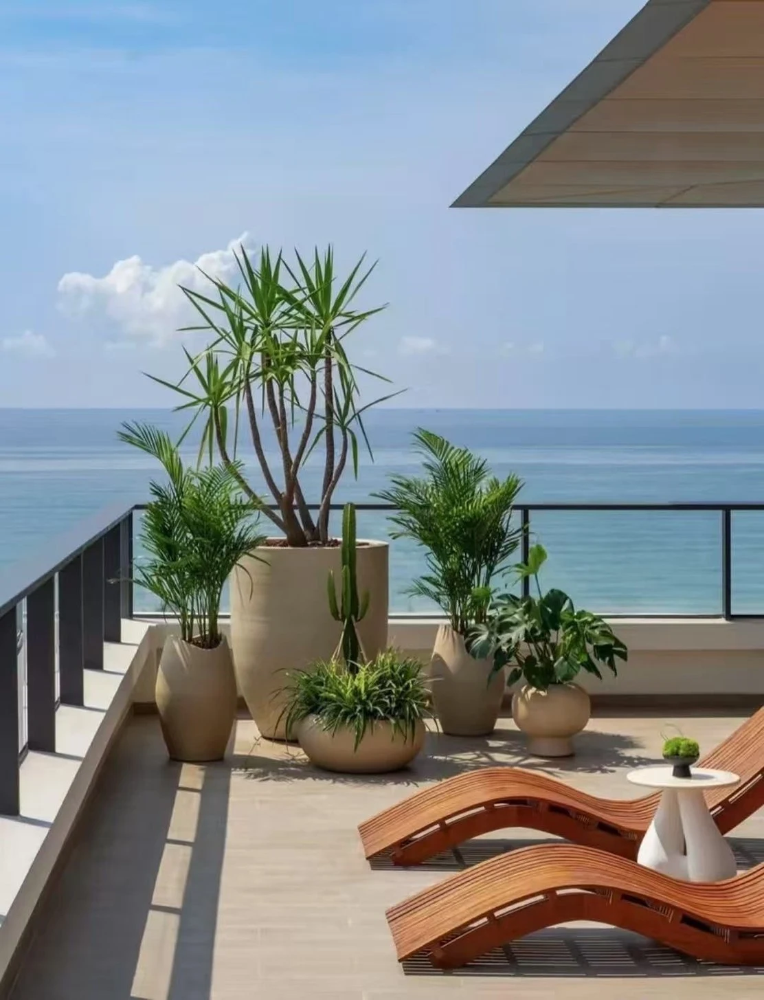 Ocean-view apartment balcony with lounge chairs in Da Nang