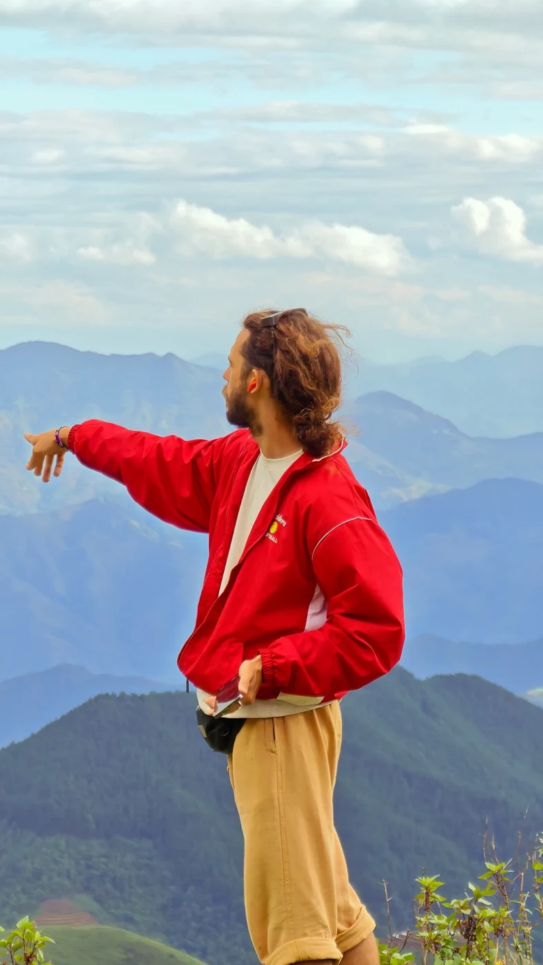 traveler looking out over mountain ridges in central Vietnam