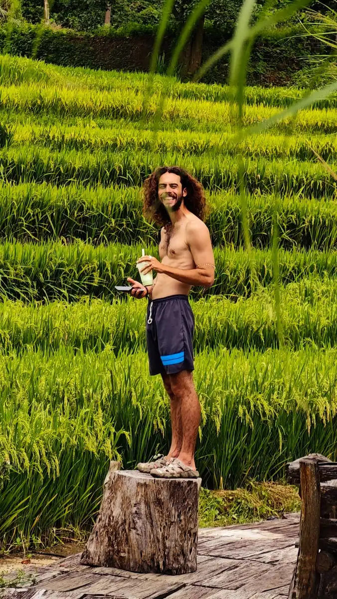 traveler standing by green rice terraces in northern Vietnam
