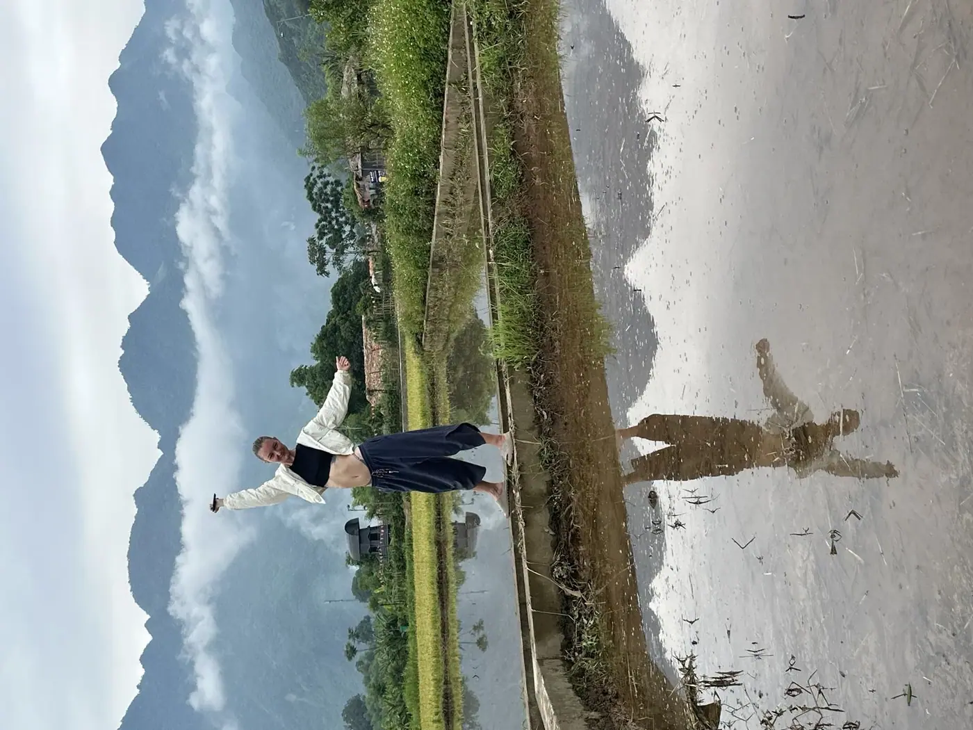 Person walking along a tidal mudflat on the Vietnam coast