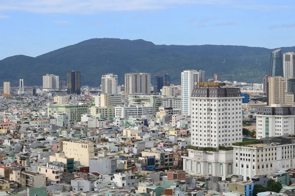 Aerial view of Da Nang cityscape with mountains and ocean