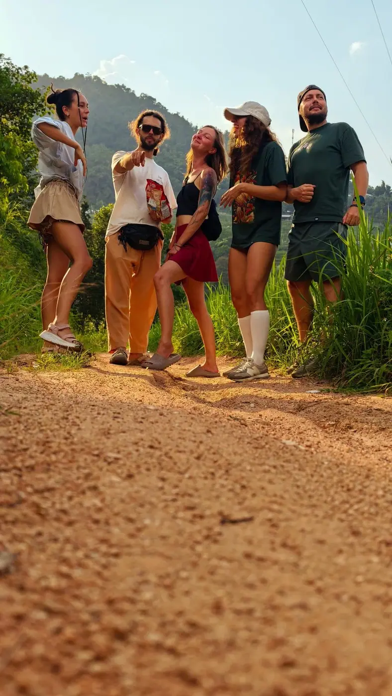 A group of expats walking a dirt trail in Vietnam