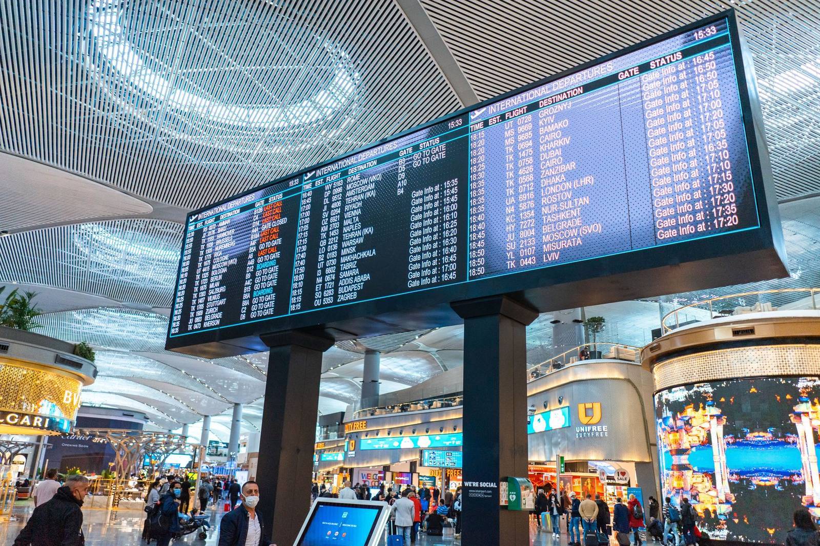 Departure board at Istanbul Airport listing connecting flights toward the Caucasus and beyond