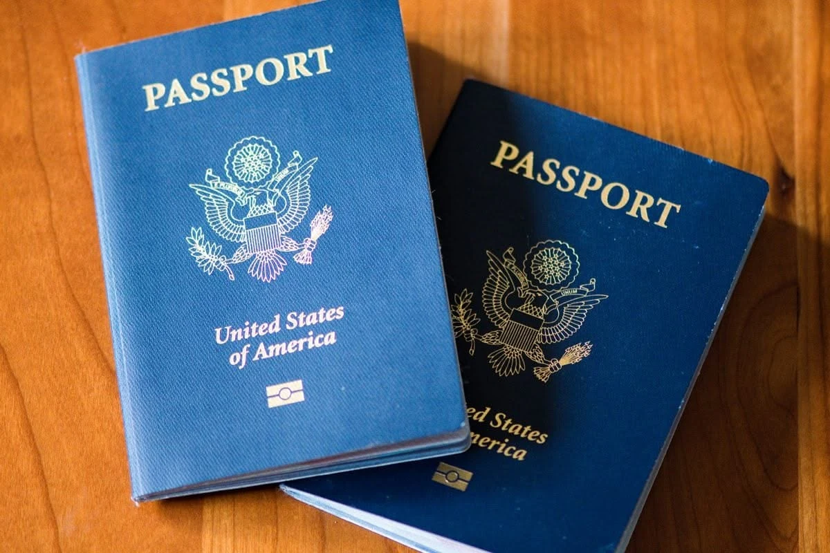 two international passports on wooden table — documents for Vietnam entry