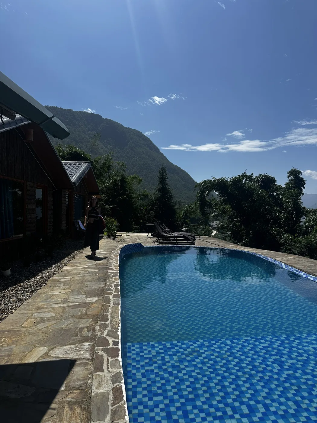 Infinity pool overlooking misty green mountains at a Sa Pa resort