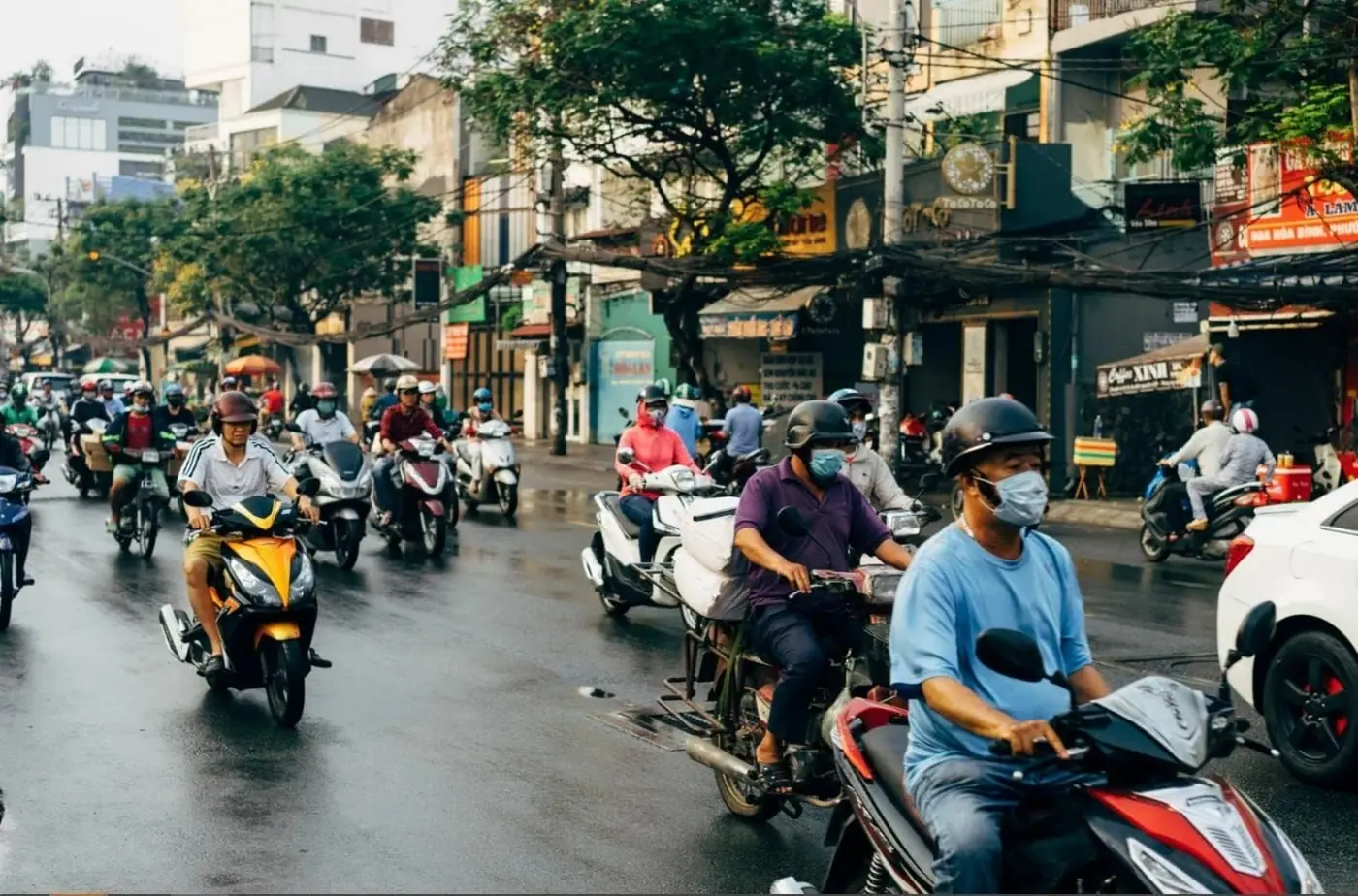 Scooters and traffic on a busy Ho Chi Minh City street