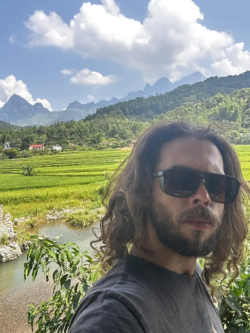 Traveler on a dirt path through rice terraces in northern Vietnam