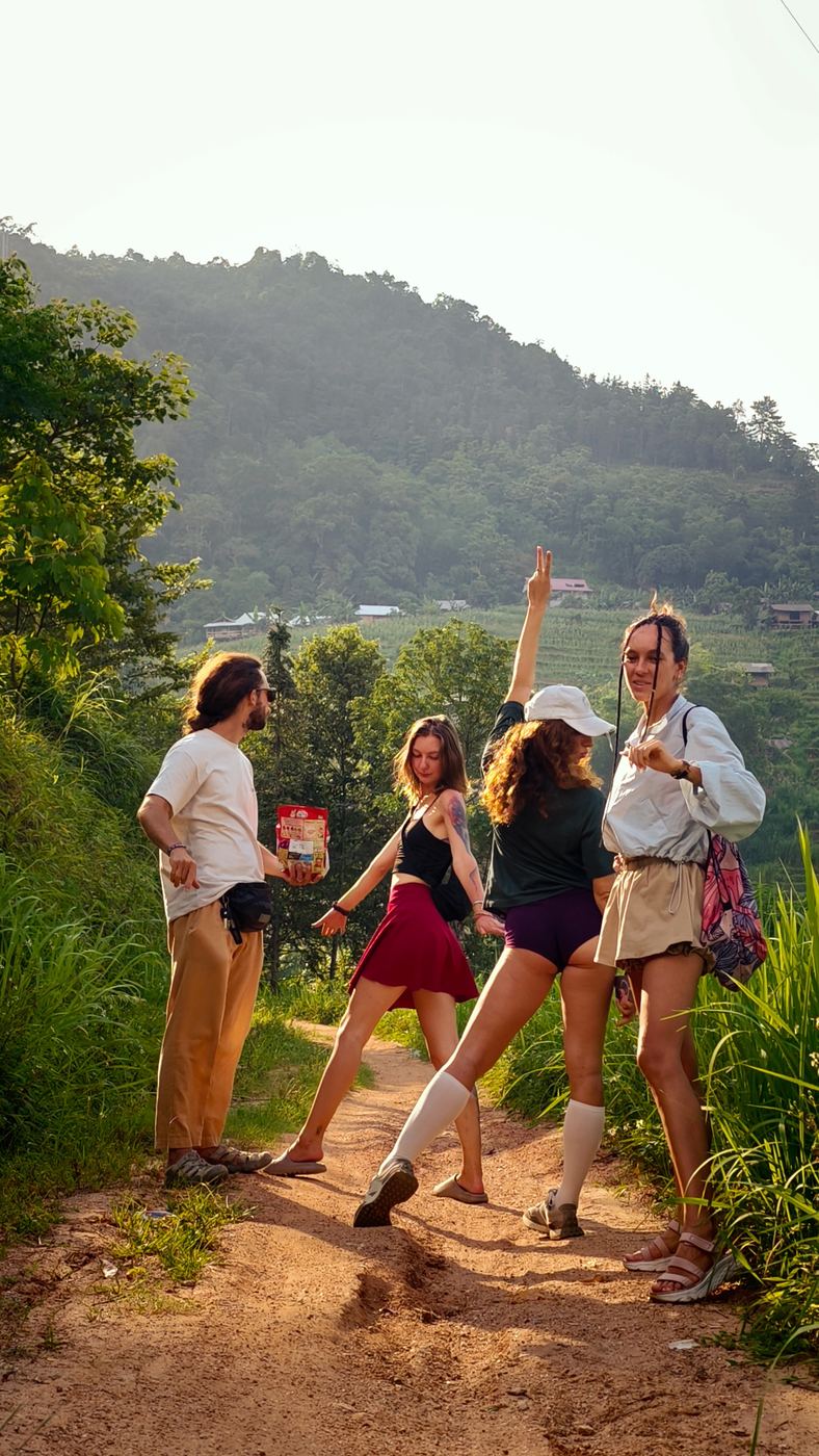 Group of travelers on a rice terrace trail, low-angle shot