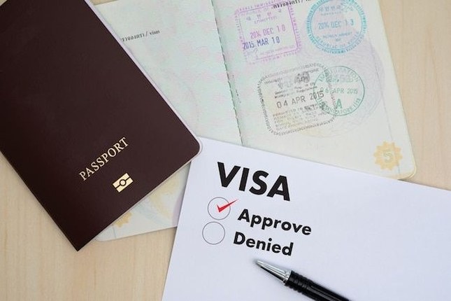 Passport with work permit checklist showing apostille and criminal record requirements