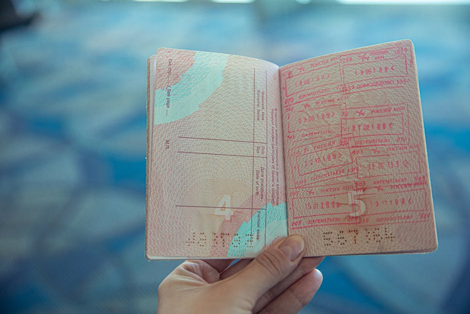 Open passport with visa stamps from multiple countries