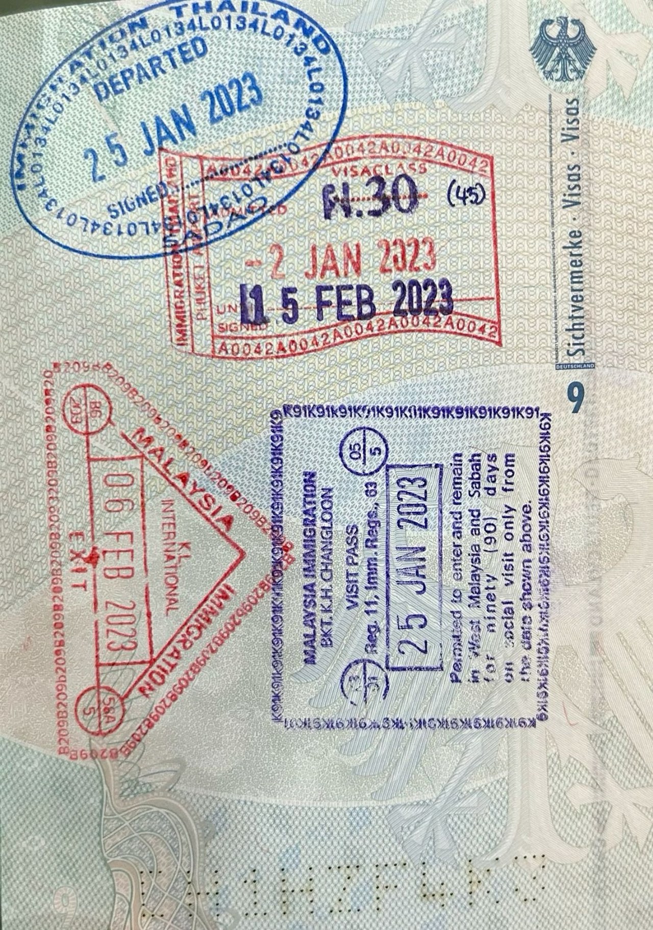 Passport pages with Southeast Asia entry and exit stamps