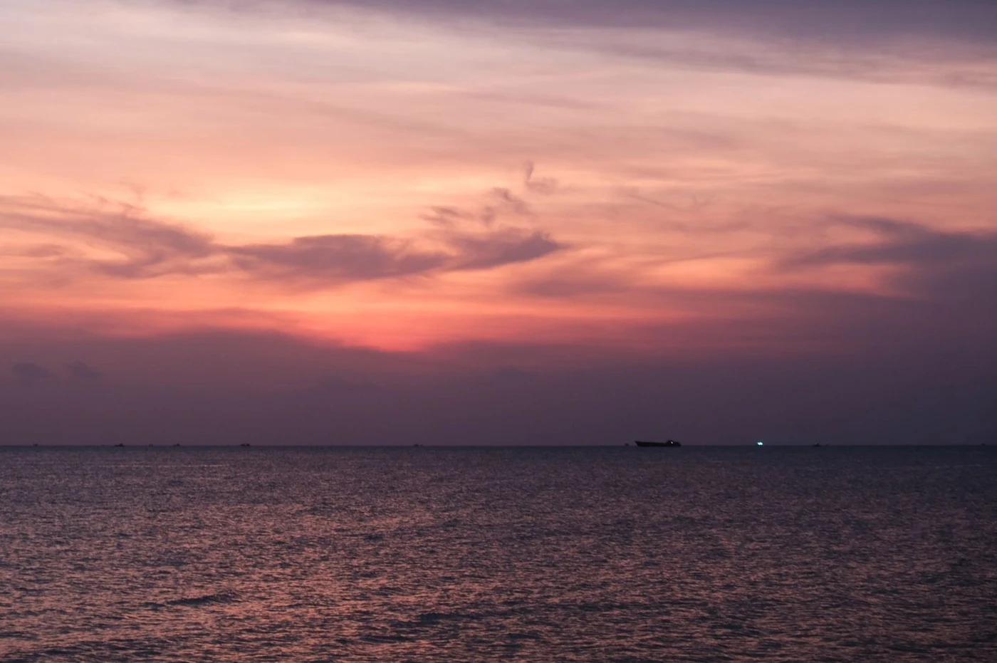 Sunset over the sea seen from a quiet shore